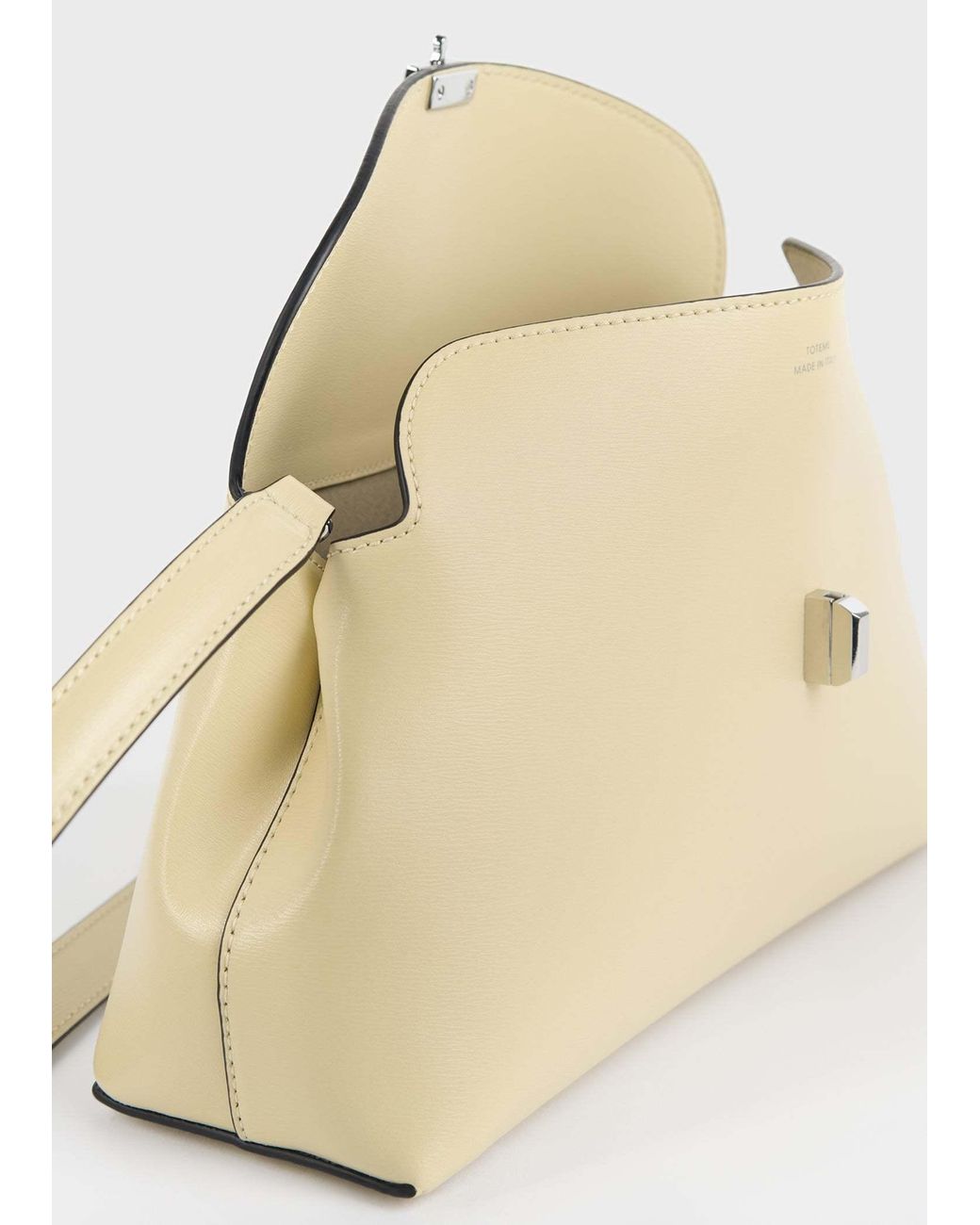 Totême Natural T-Lock Leather Clutch Bag