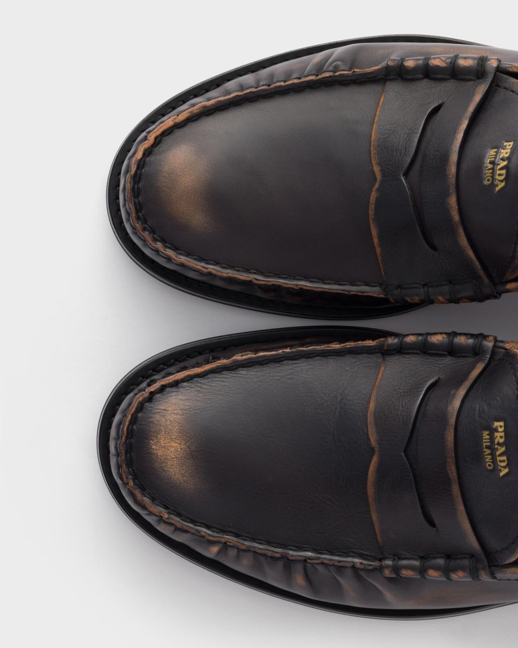 Prada Black Distressed Penny Loafers for men