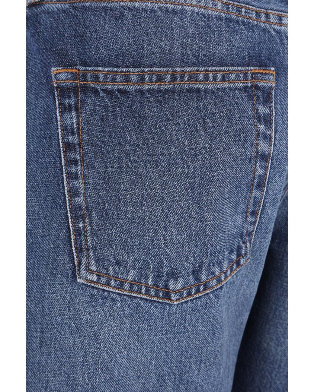 Totême  Blue Washed-Effect Twisted-Seam Jeans