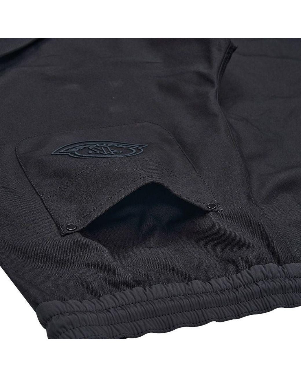 Moncler Black Logo Embroidered Tapered Leg Trousers for men