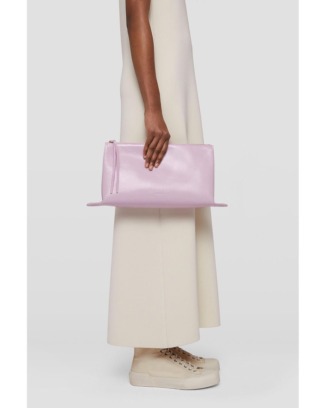 Jil Sander Purple Logo Embossed Zipped Clutch Bag