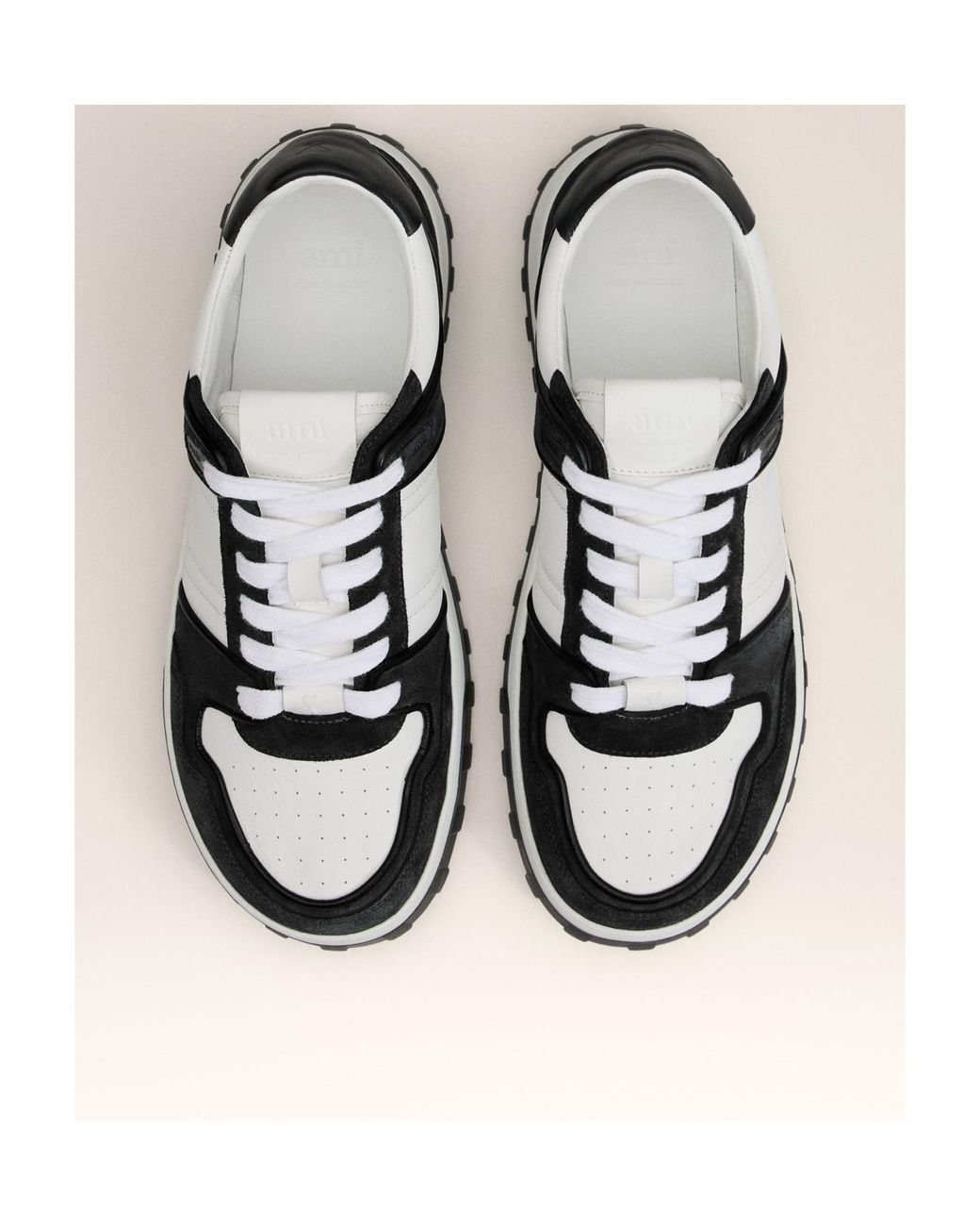 AMI Black Ami Logo Embossed Low-Top Sneakers for men
