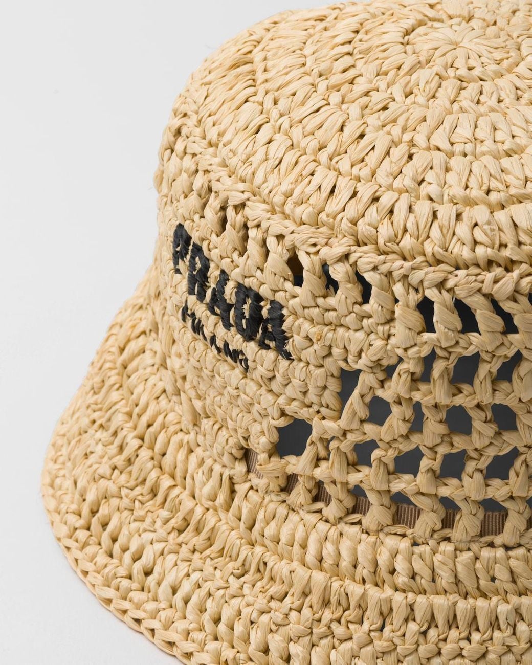 Prada Natural Logo Detailed Interwoven Bucket Hat