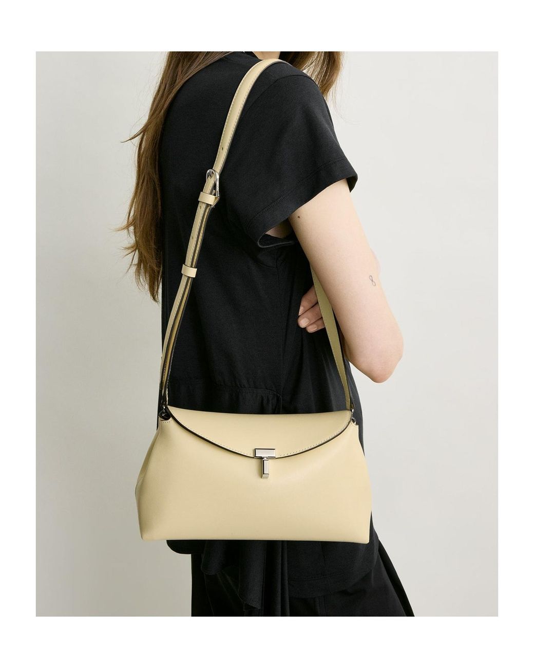 Totême Natural T-Lock Leather Clutch Bag
