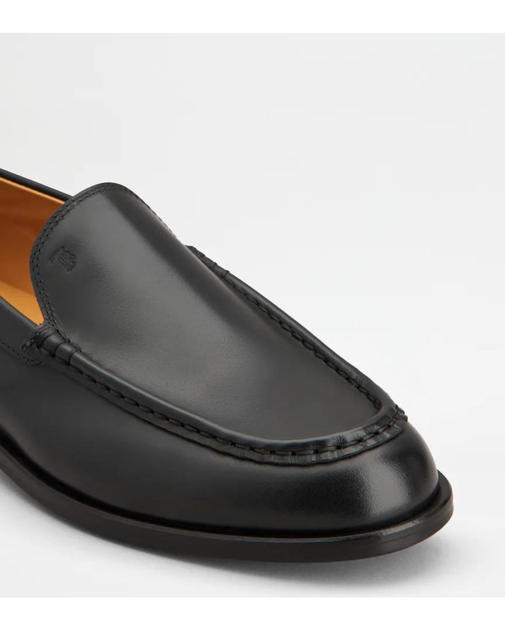 Tod's Black Slip-On Loafers
