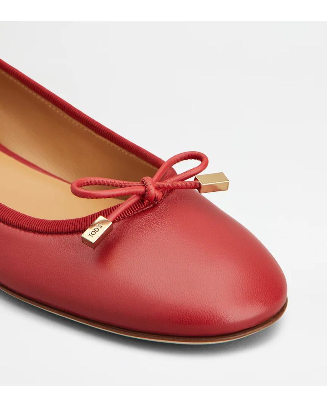 Tod's Red Round-Toed Ballet Shoes