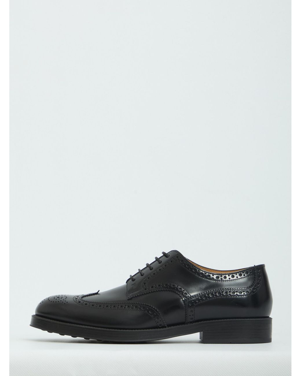 Tod's Black Wingtip Brogue Derby Shoes for men