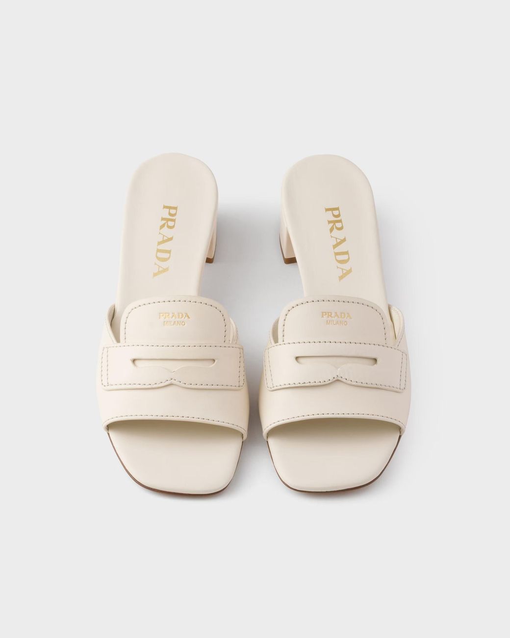 Prada White Penny Strap Block Heel Mules