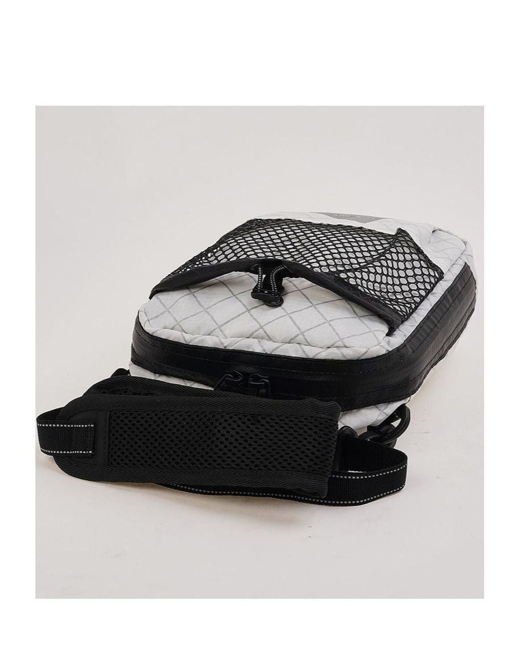 And Wander Black Mesh Pocket Shoulder Bag for men