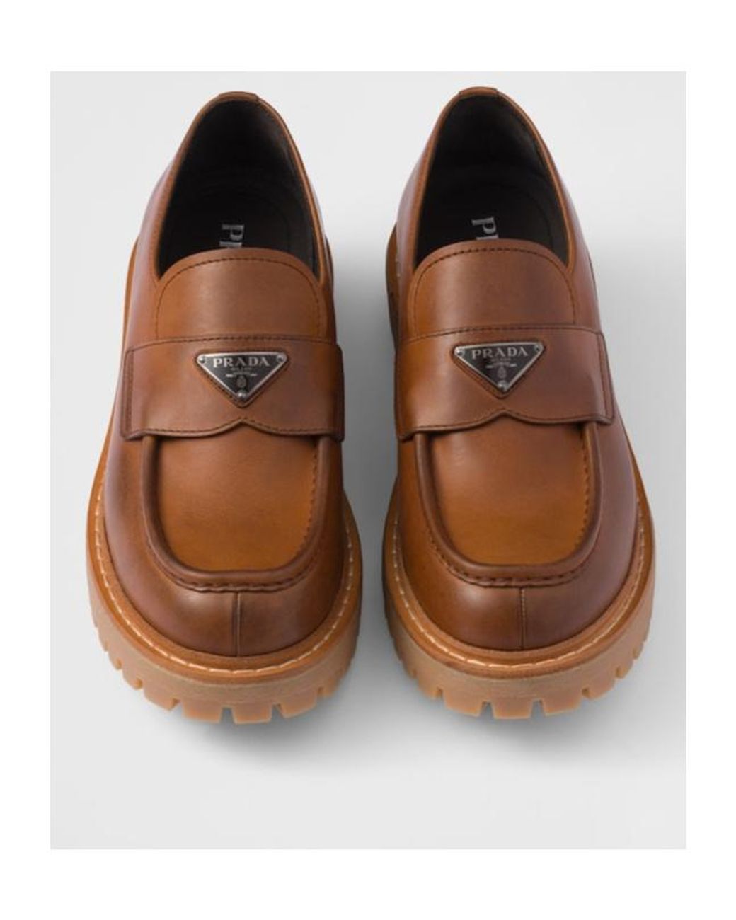 Prada Brown Logo Plaque Round Toe Loafers for men