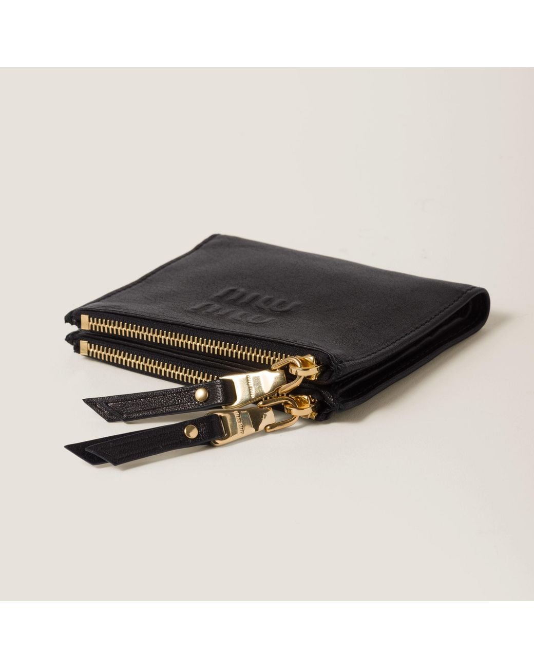 Miu Miu Black Logo Embossed Zipped Wallet