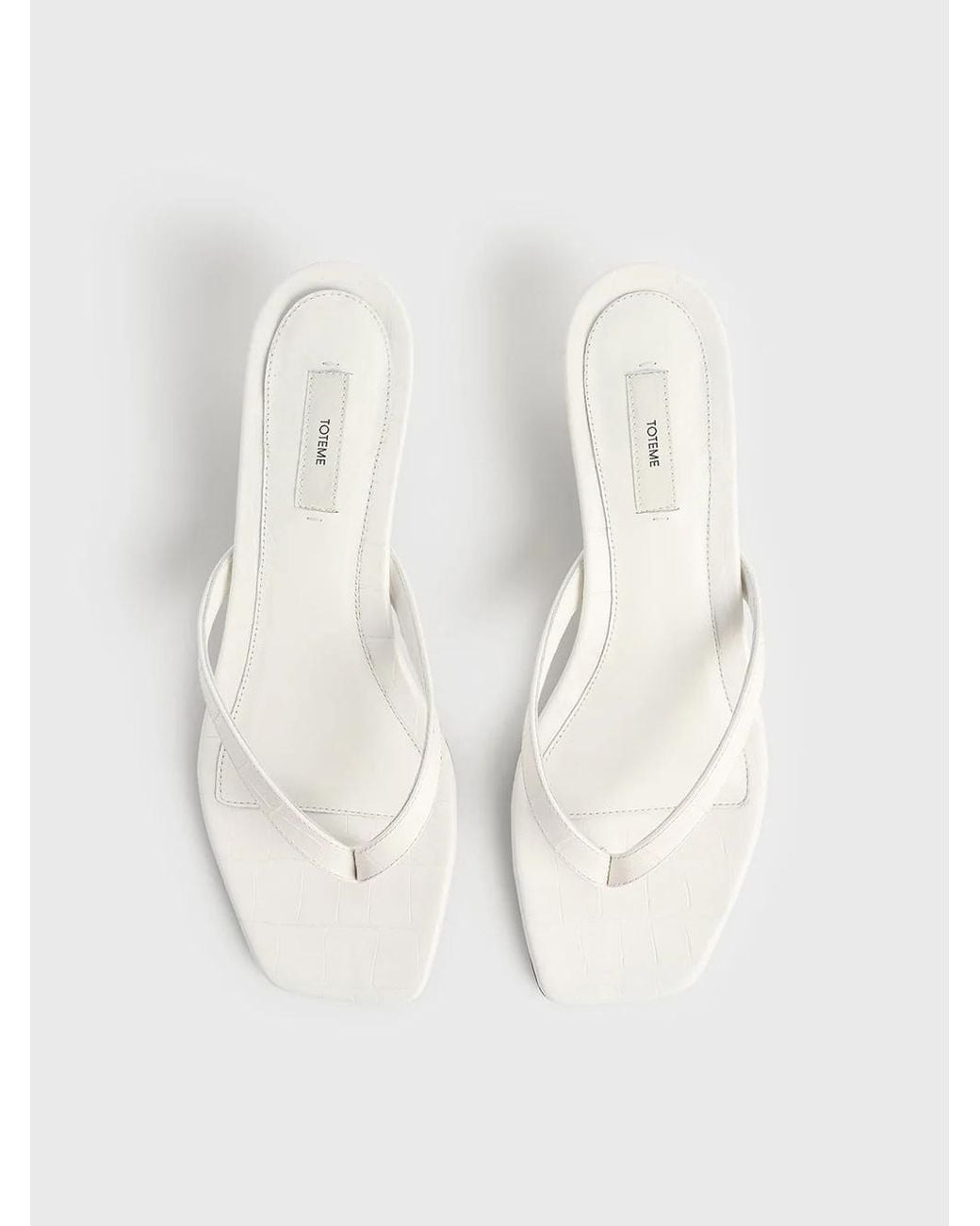 Totême White Totême Embossed Flip Flops