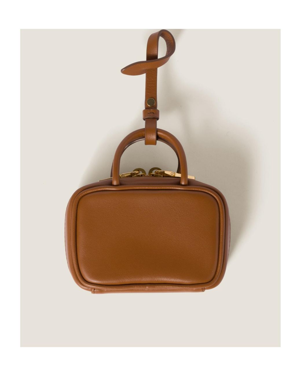 MIUMIU トリックキーリング ブラウン Miu Miu Logo-Embossed Trick Keychain in Brown | Lyst