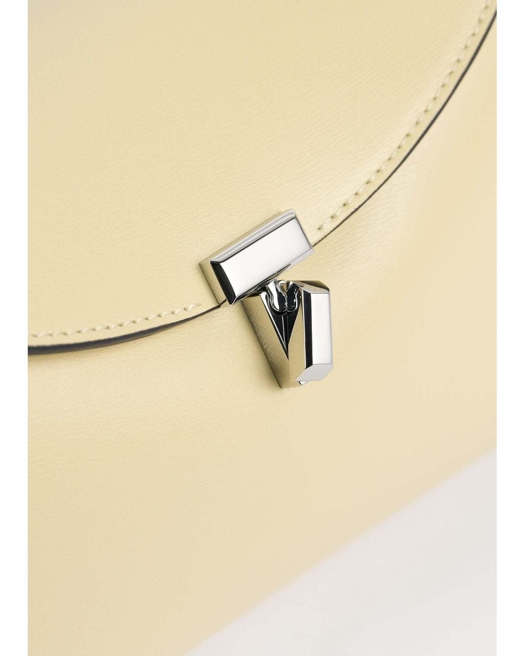 Totême Natural T-Lock Leather Clutch Bag