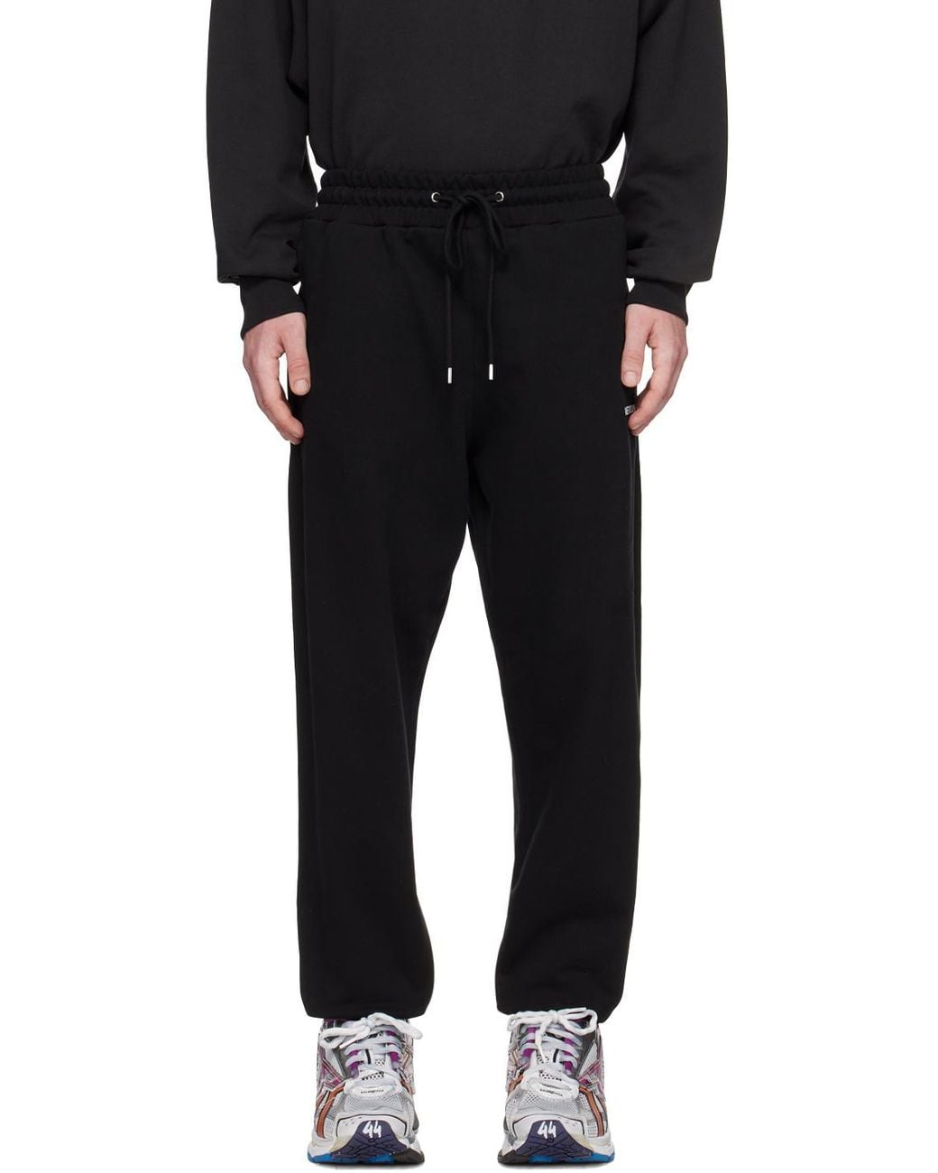 we11done Black Logo-Detail Trousers for men