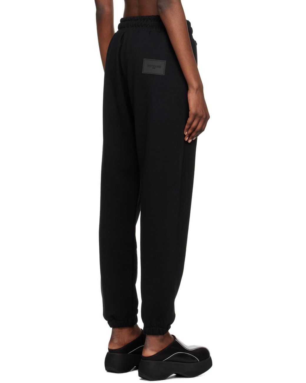 we11done Black Logo-Detail Trousers for men