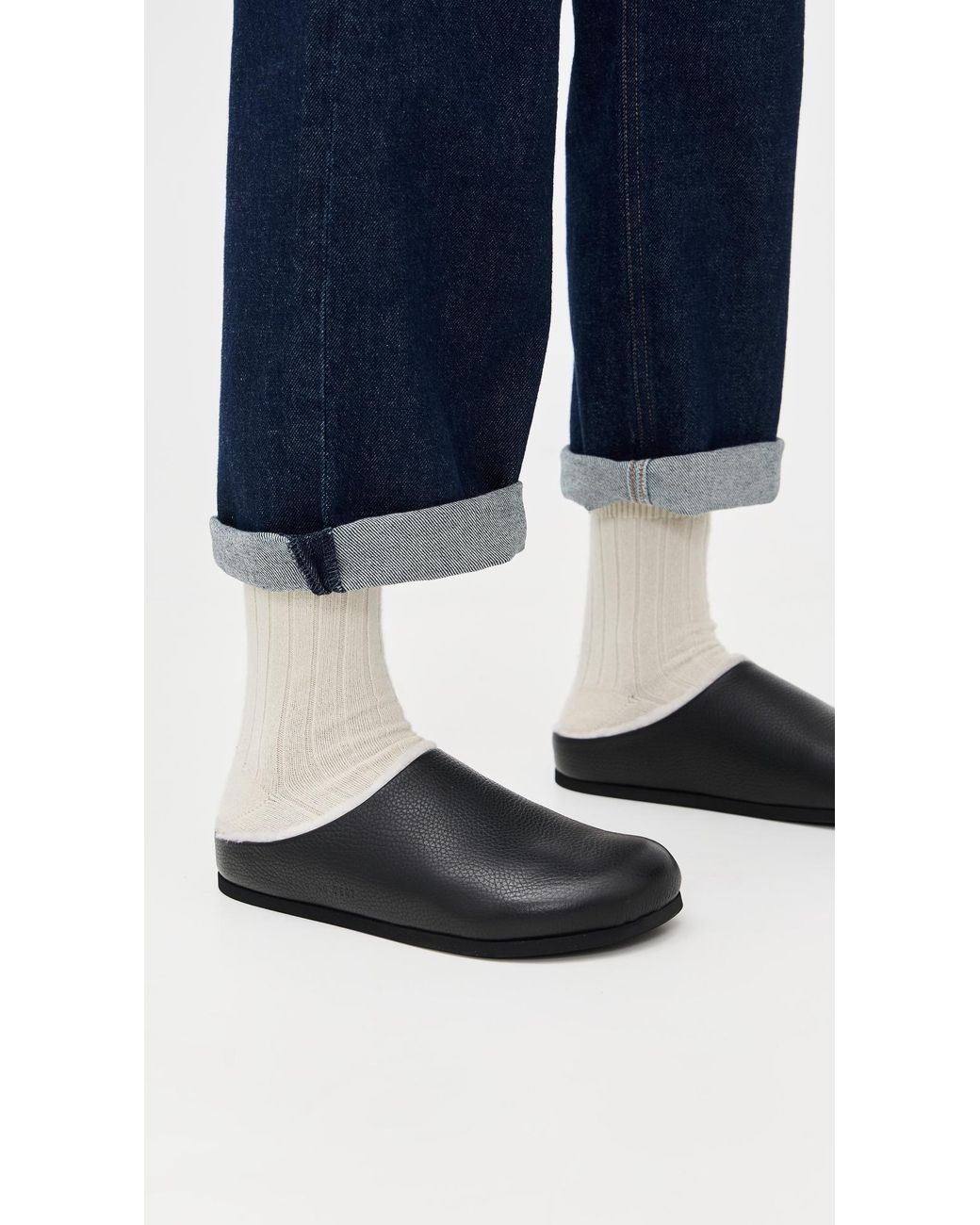 Common Projects Black Clogs