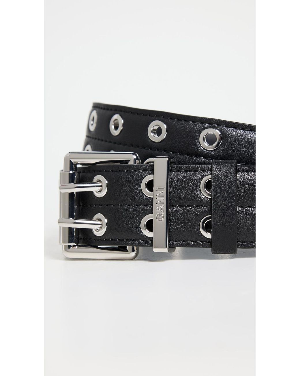 GANNI｜ (Black Double Eyelet Belt (A6586 099)) Ganni double eyelet belt in black with silver hardware. PIPE