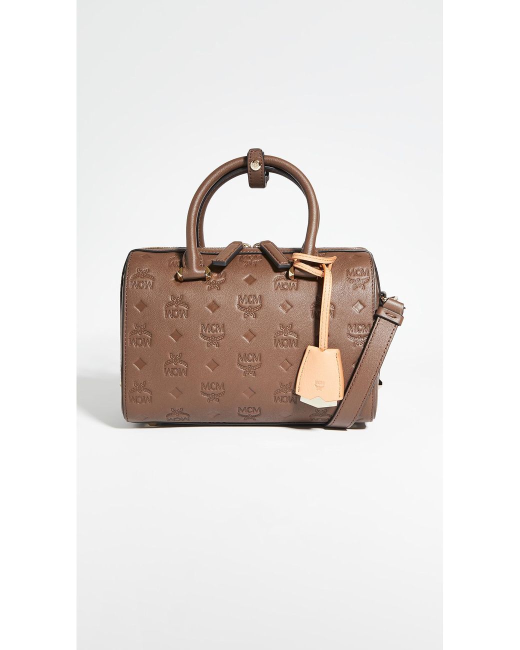 MCM Essential Monogrammed Leather Boston 23 Bag in Chestnut (Brown) | Lyst