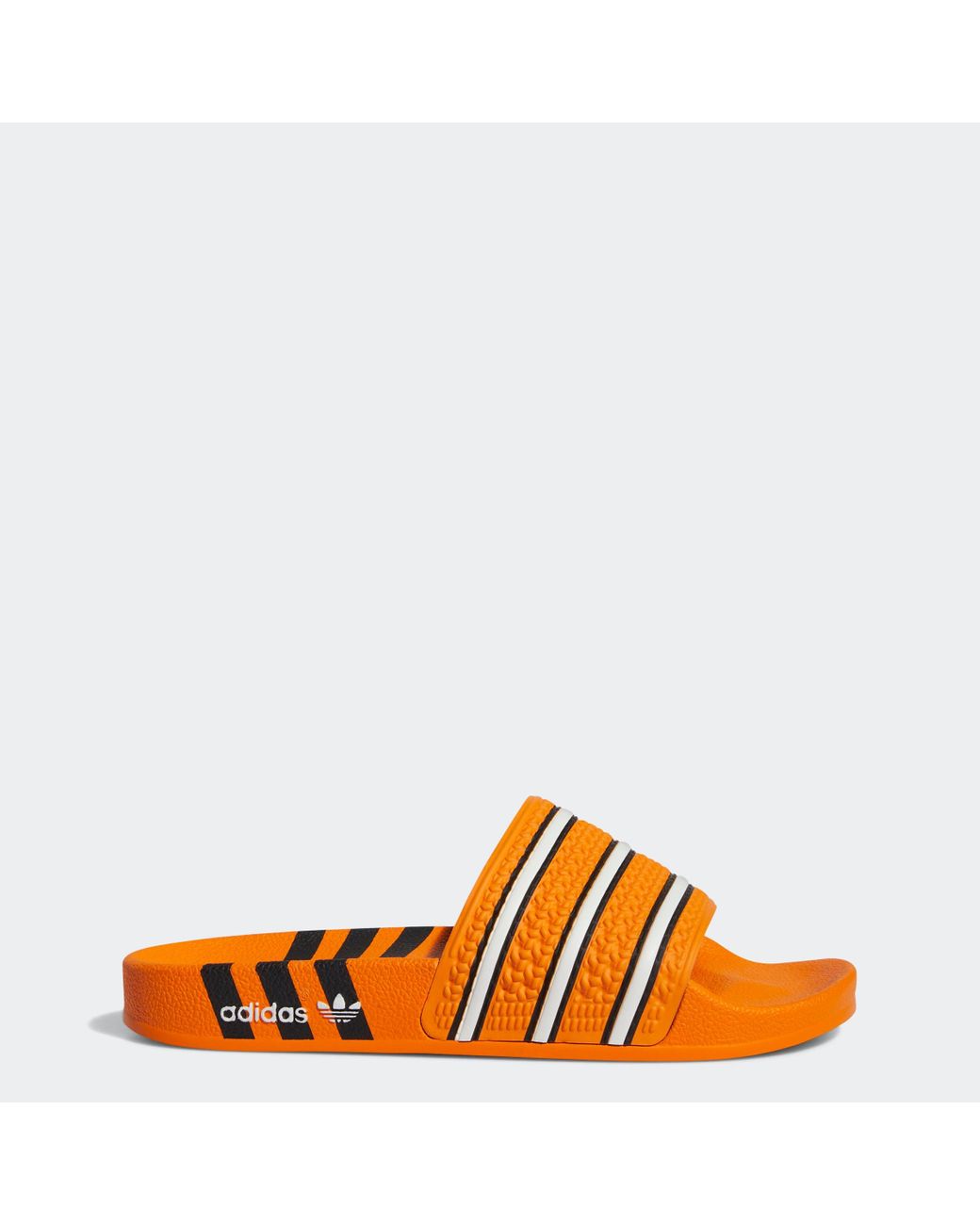 adidas Adilette Slides in Orange | Lyst