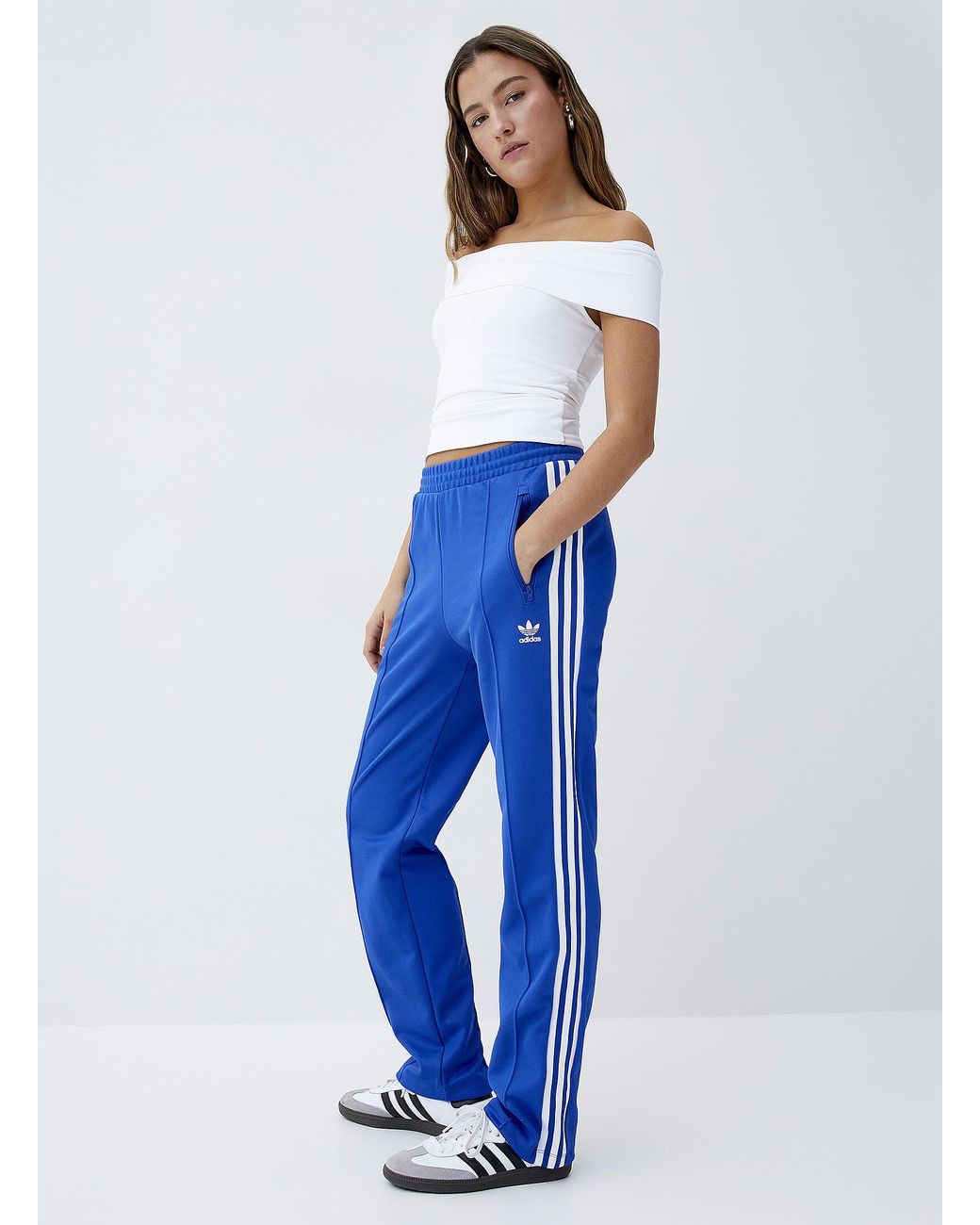 blue adidas track pants womens