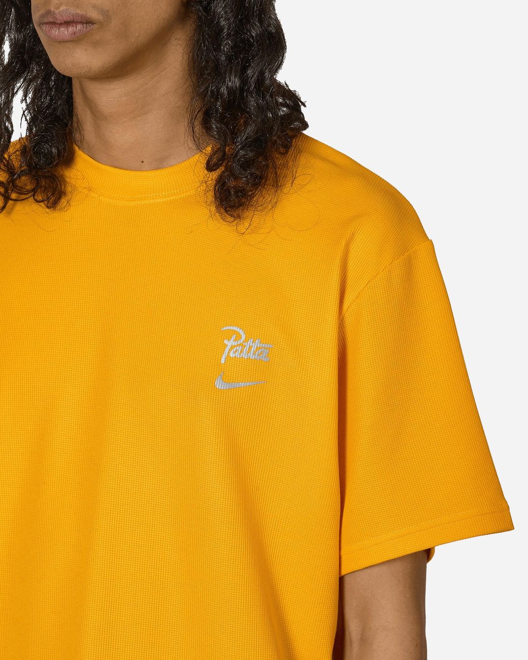 orange and yellow nike shirt