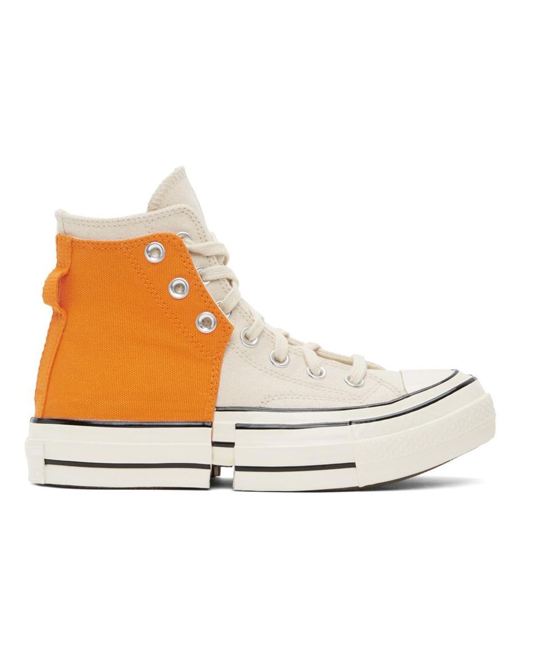 white converse orange bottoms