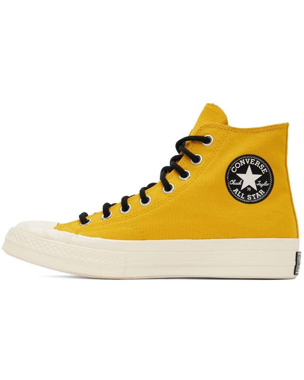 Dark yellow shop converse