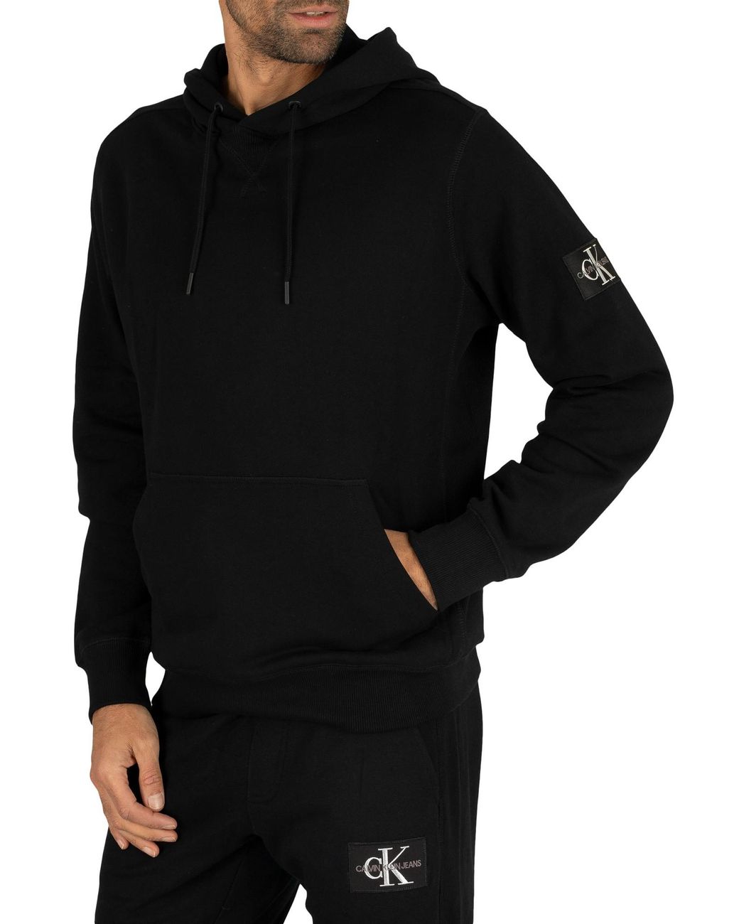 Calvin Klein Monogram Sleeve Badge Pullover Hoodie in Black for