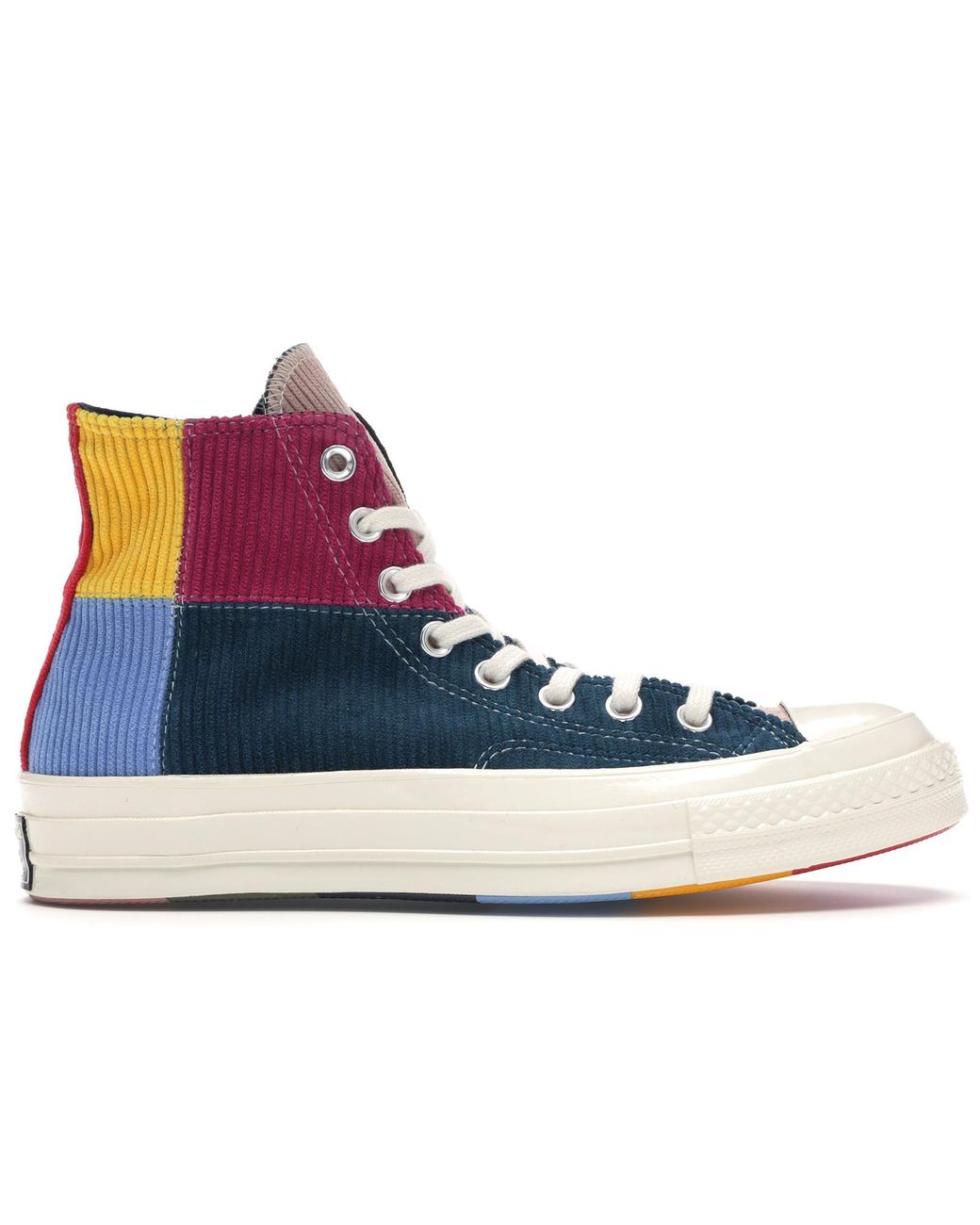 all blue chucks with the gold spikes