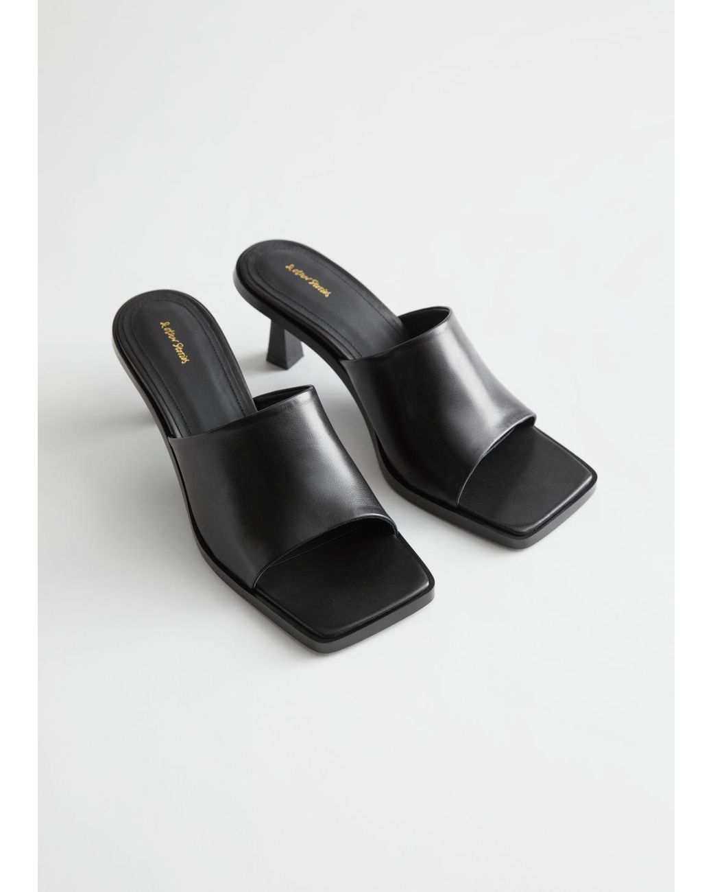 black leather mules low heel