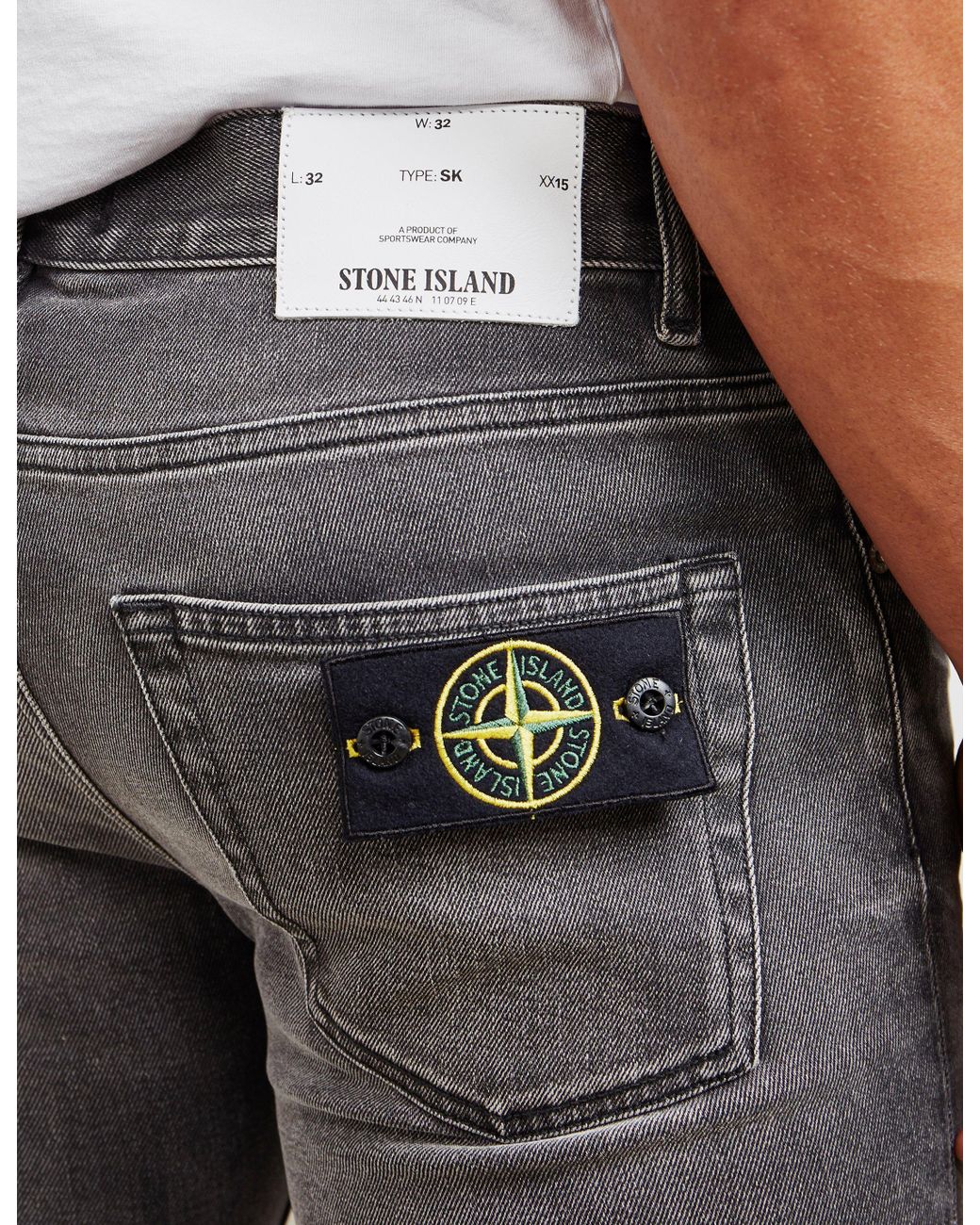 stone island ripped jeans