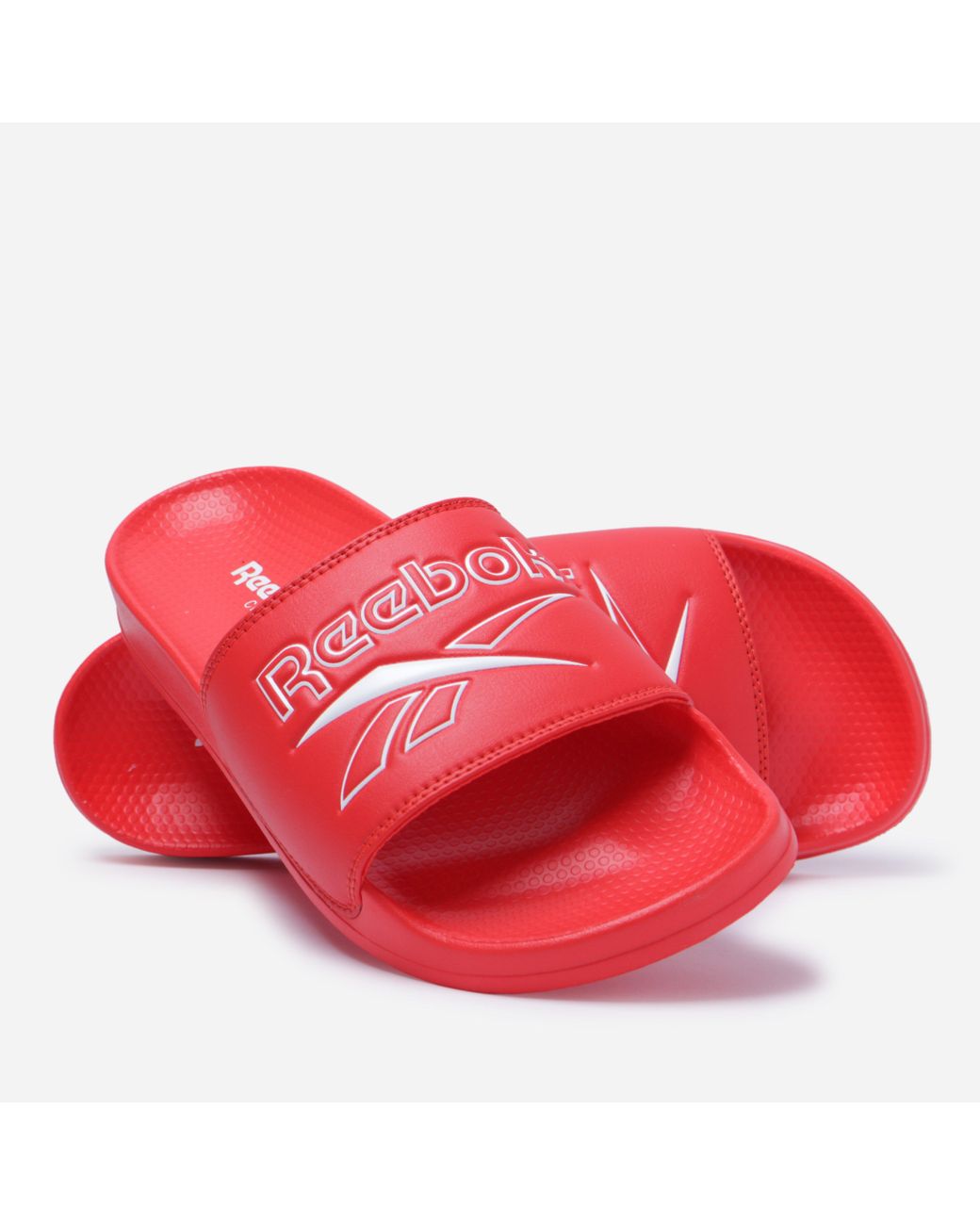 red reebok slides
