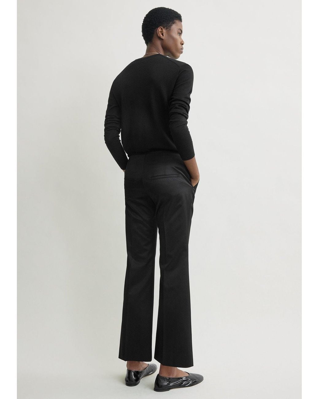 Totême  Black Kick Flare Raw-Edge Trousers