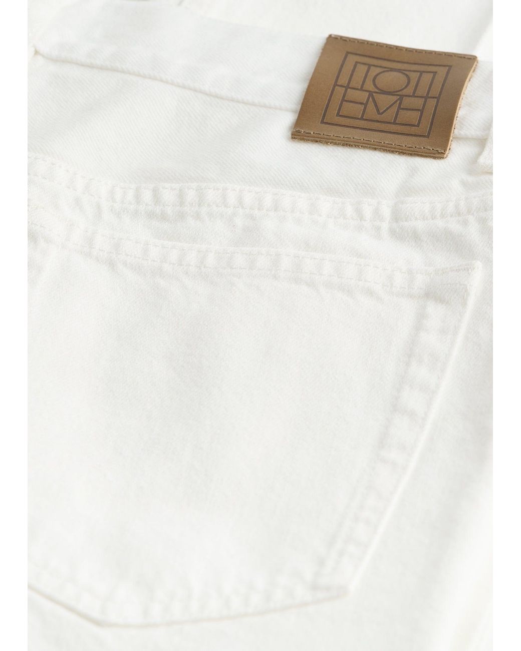 Totême White Kick Flare Denim