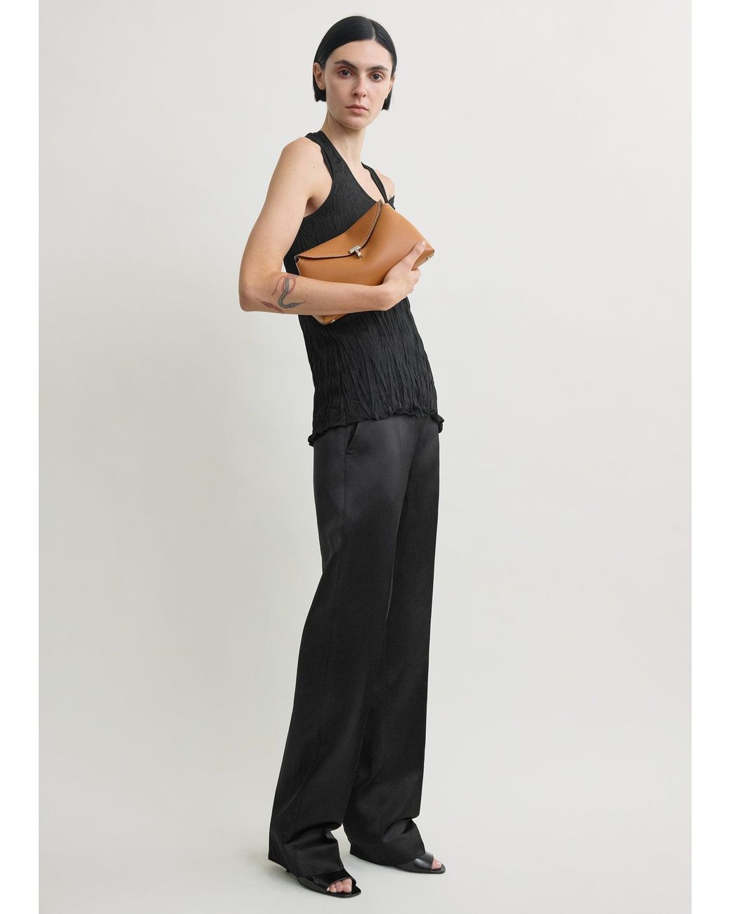 TOTEME T-Lock Grained-Leather Clutch Tan in White | Lyst