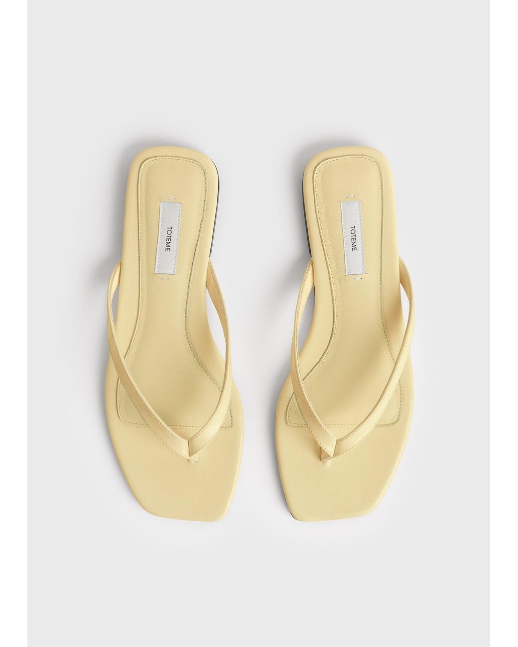 Totême White Naplack Flip Flops
