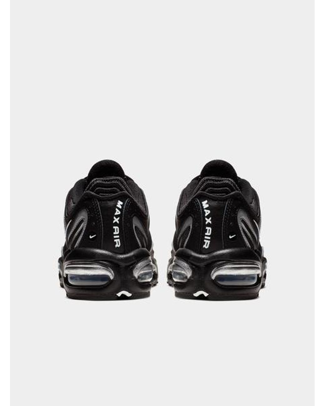 nike tailwind black and silver