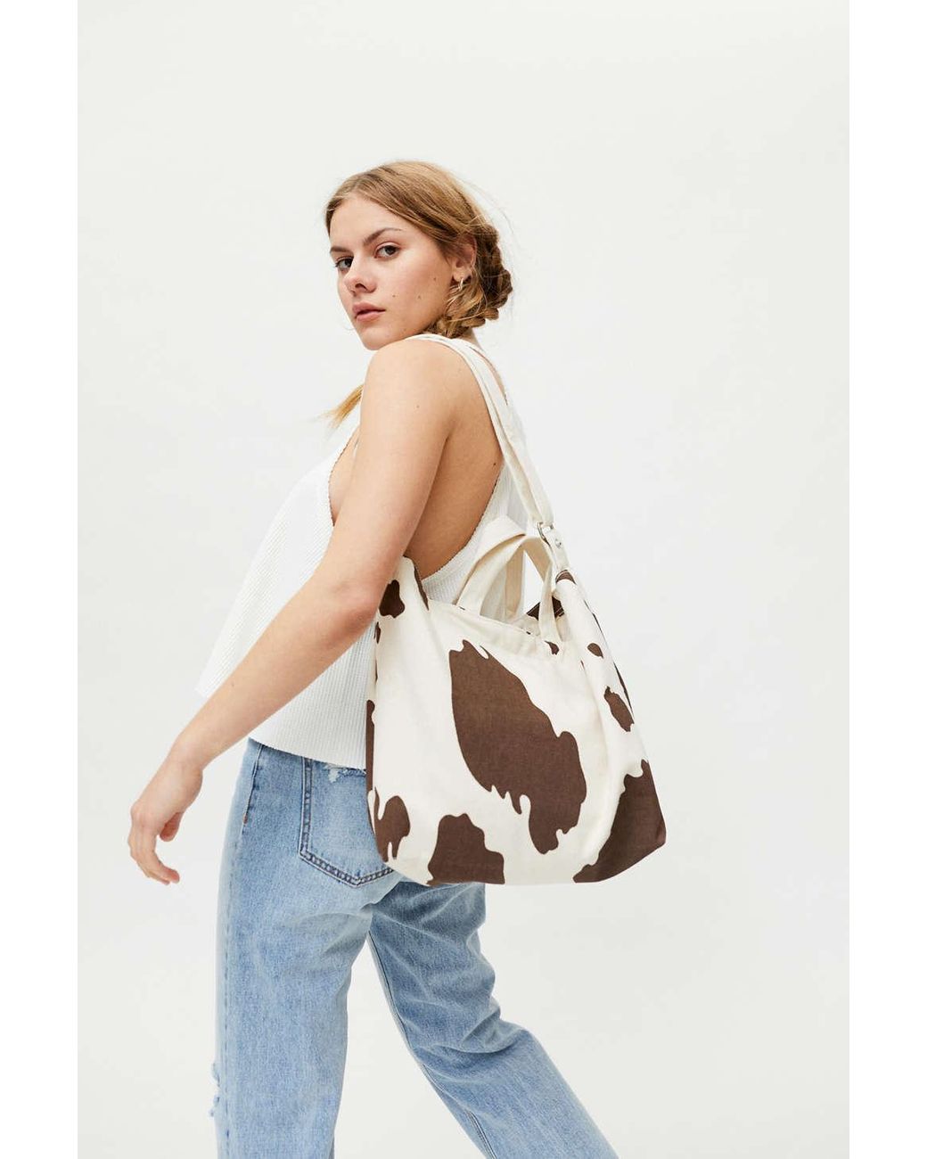 Urban outfitters cow print bag hotsell