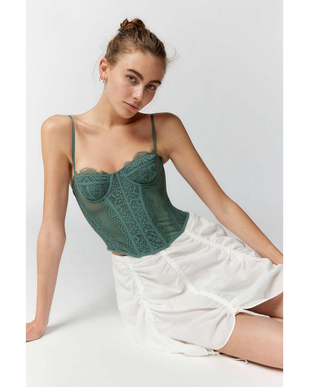 https://cdna.lystit.com/1040/1300/n/photos/urbanoutfitters/a4a8a18b/out-from-under-Olive-Green-Modern-Love-Corset.jpeg