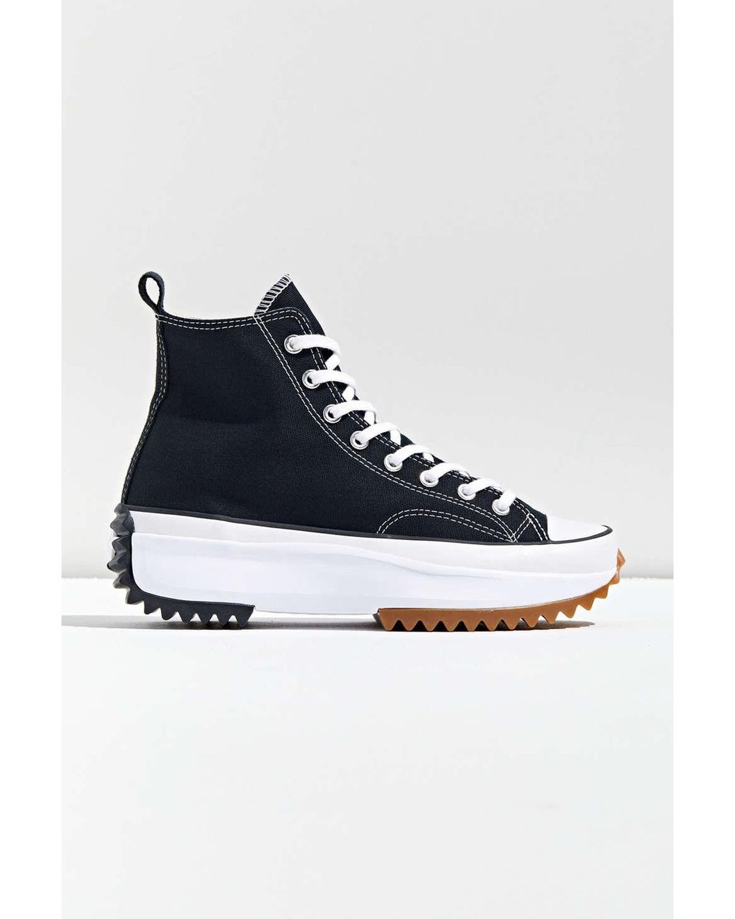 black run star hike high top sneakers
