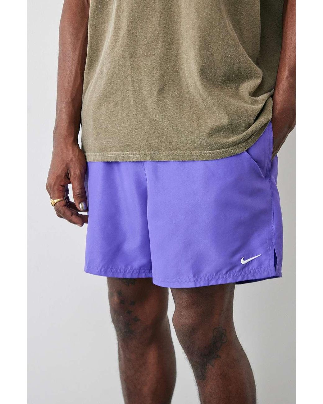 purple nike swim trunks