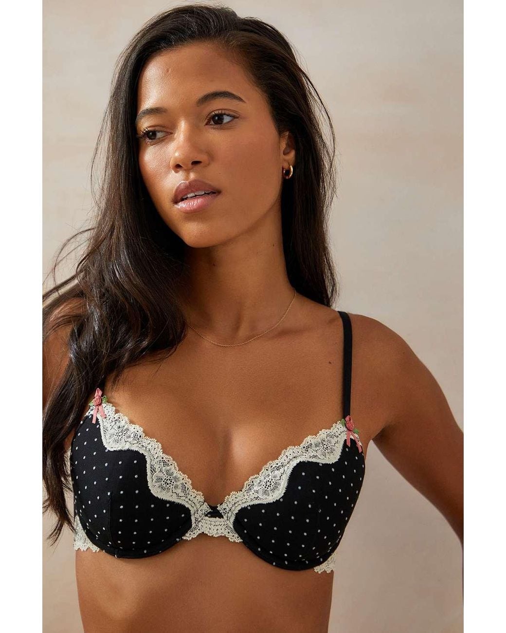 Premium Photo | A woman wearing a black and white polka dot bra