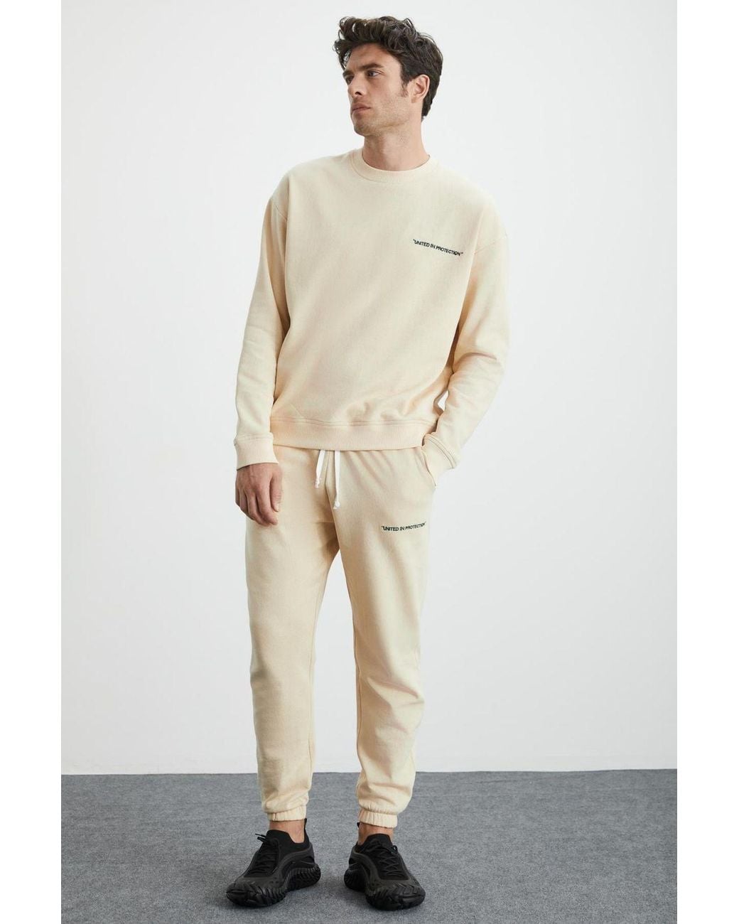 Grimelange White Elastic Waist Long Joggers for men