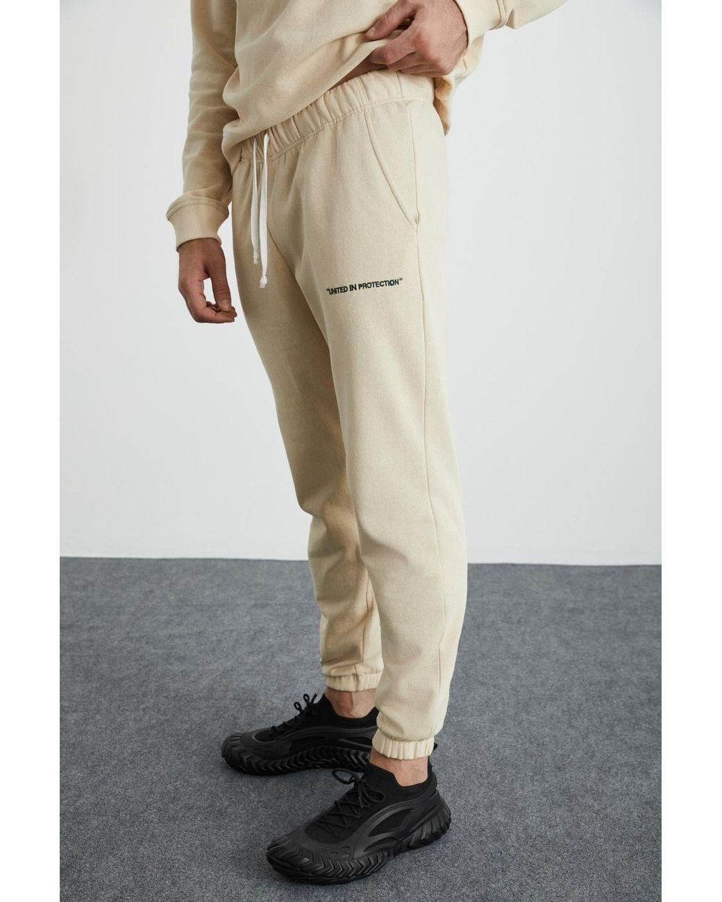 Grimelange White Elastic Waist Long Joggers for men