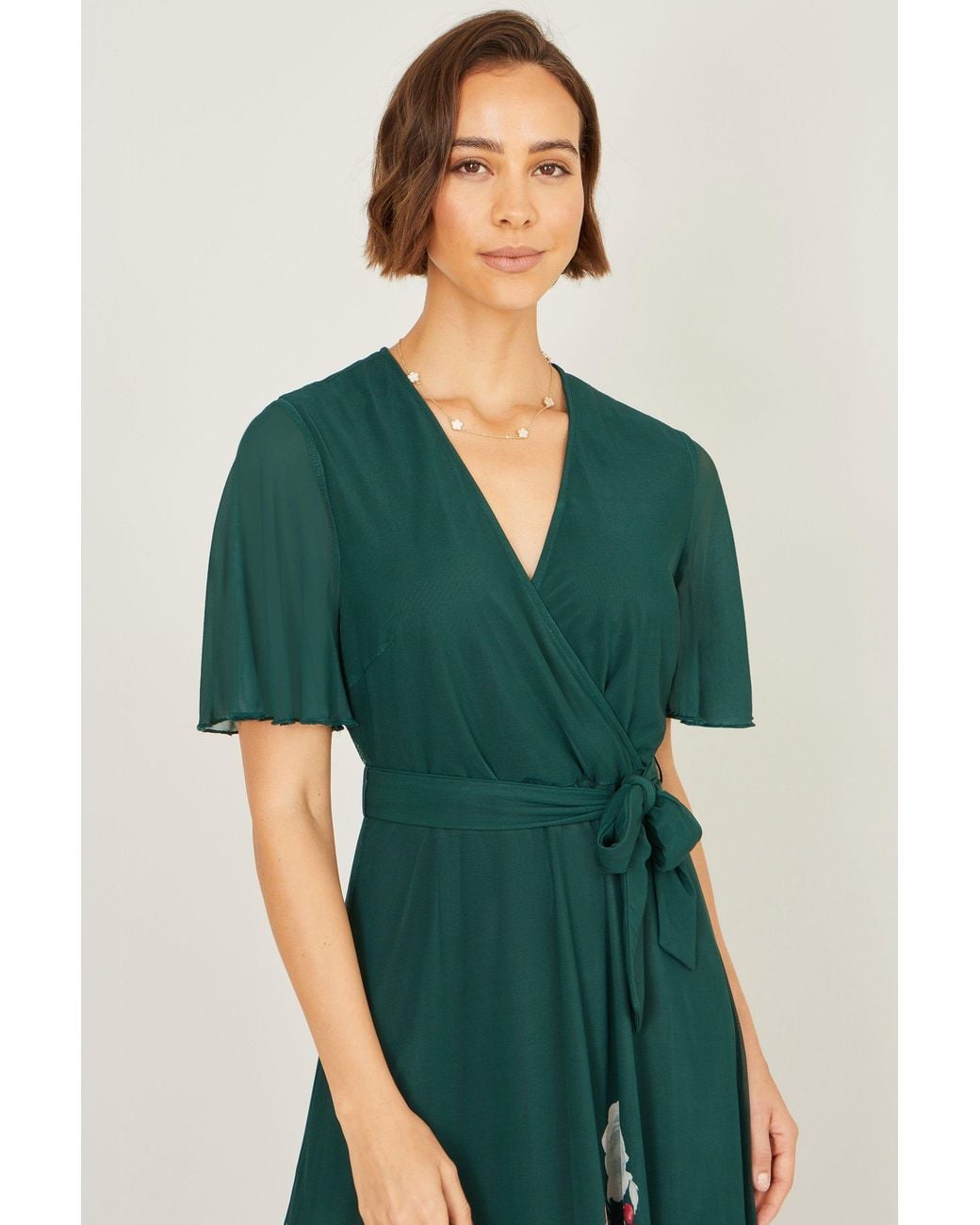Yumi' Mesh Wrap Midi Dress With Floral Hem Border in Green | Lyst