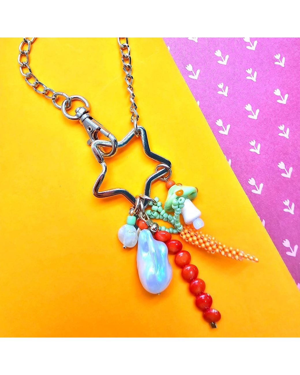 Farra Metallic Baroque Pearl Bamboo Coral And Handcrafted Carrot Bag Charm