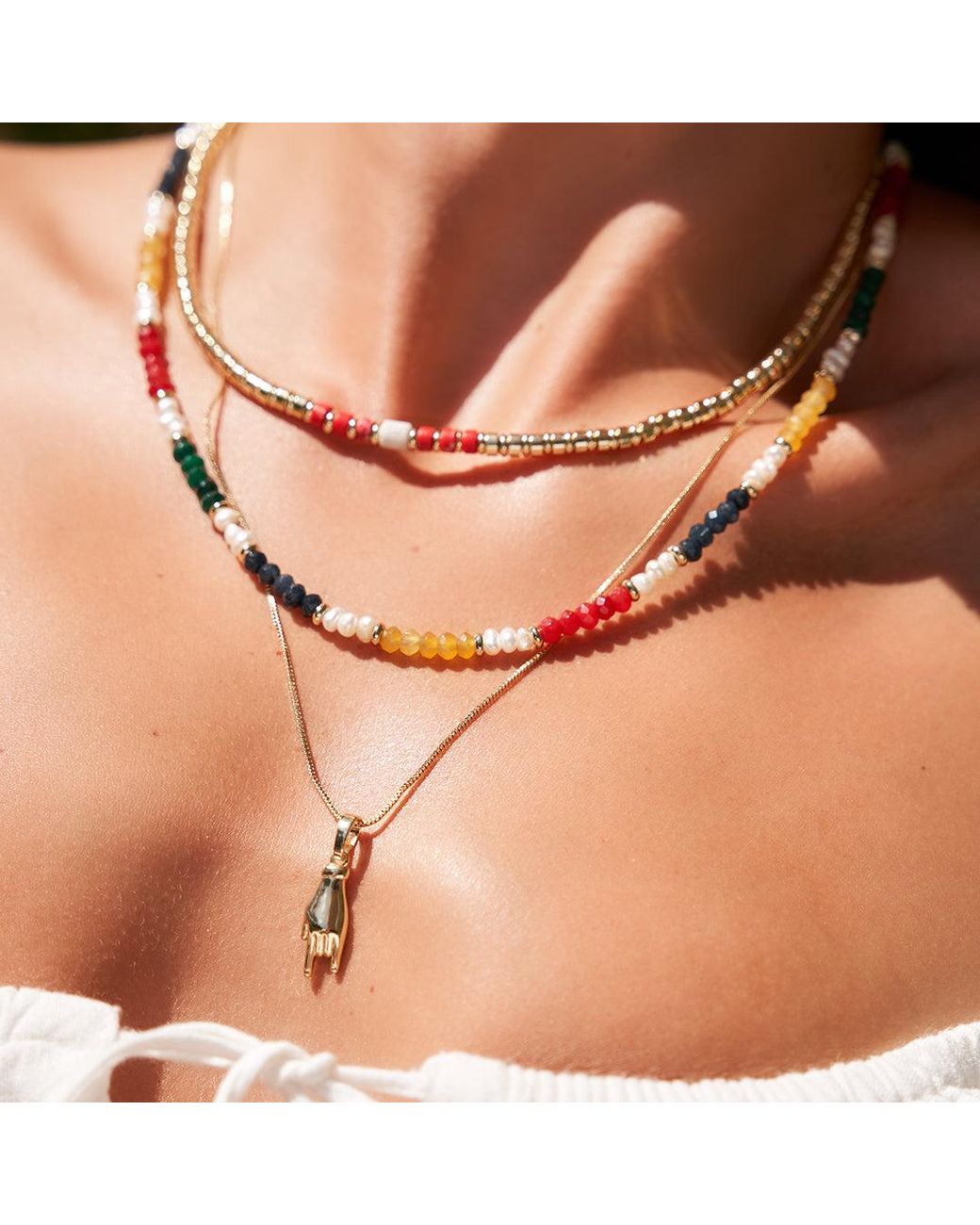 ARMS OF EVE Metallic Mano Charm Necklace