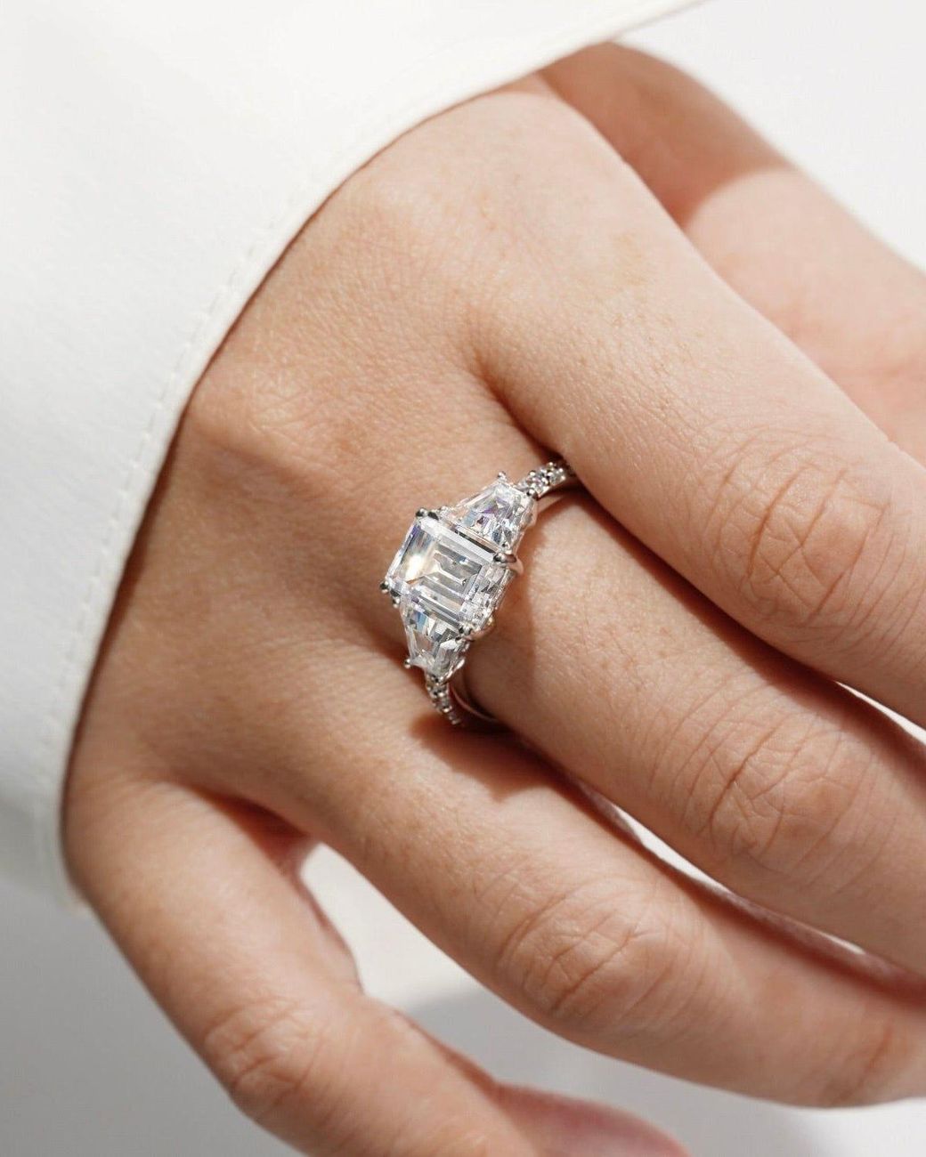 Diamonbliss White Emerald Cut With Trapeze Side Stone Engagement Ring