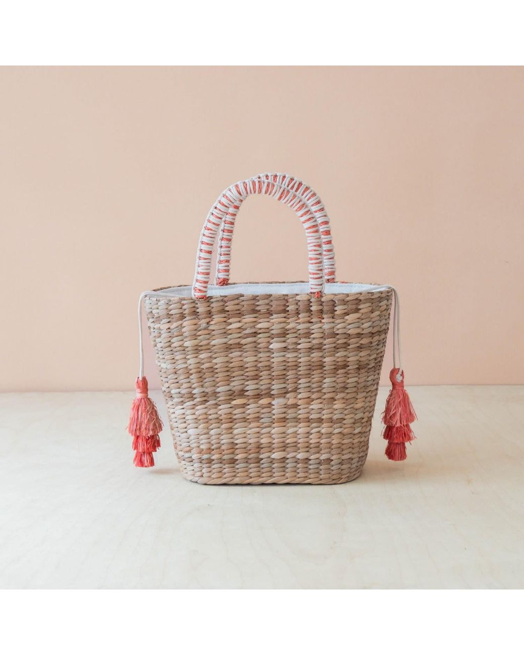 LIKHÂ Pink Neutrals Handwoven Seagrass Tomato Tote Bag With Tassels